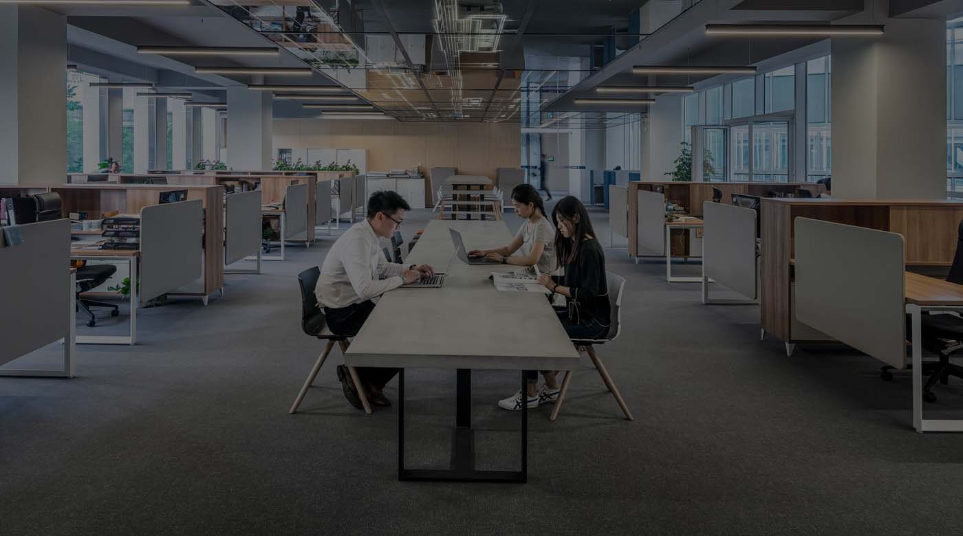 Open-plan coworking space in Hong Kong with natural light and comfortable seating