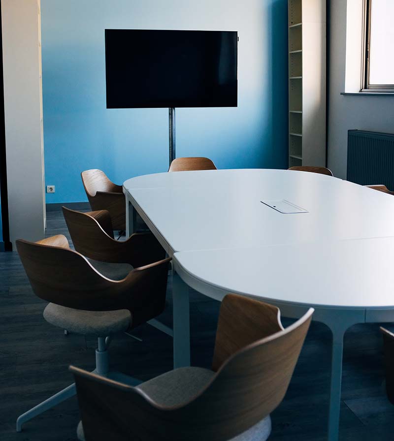 Professional meeting room in Hong Kong with conference table and presentation screen